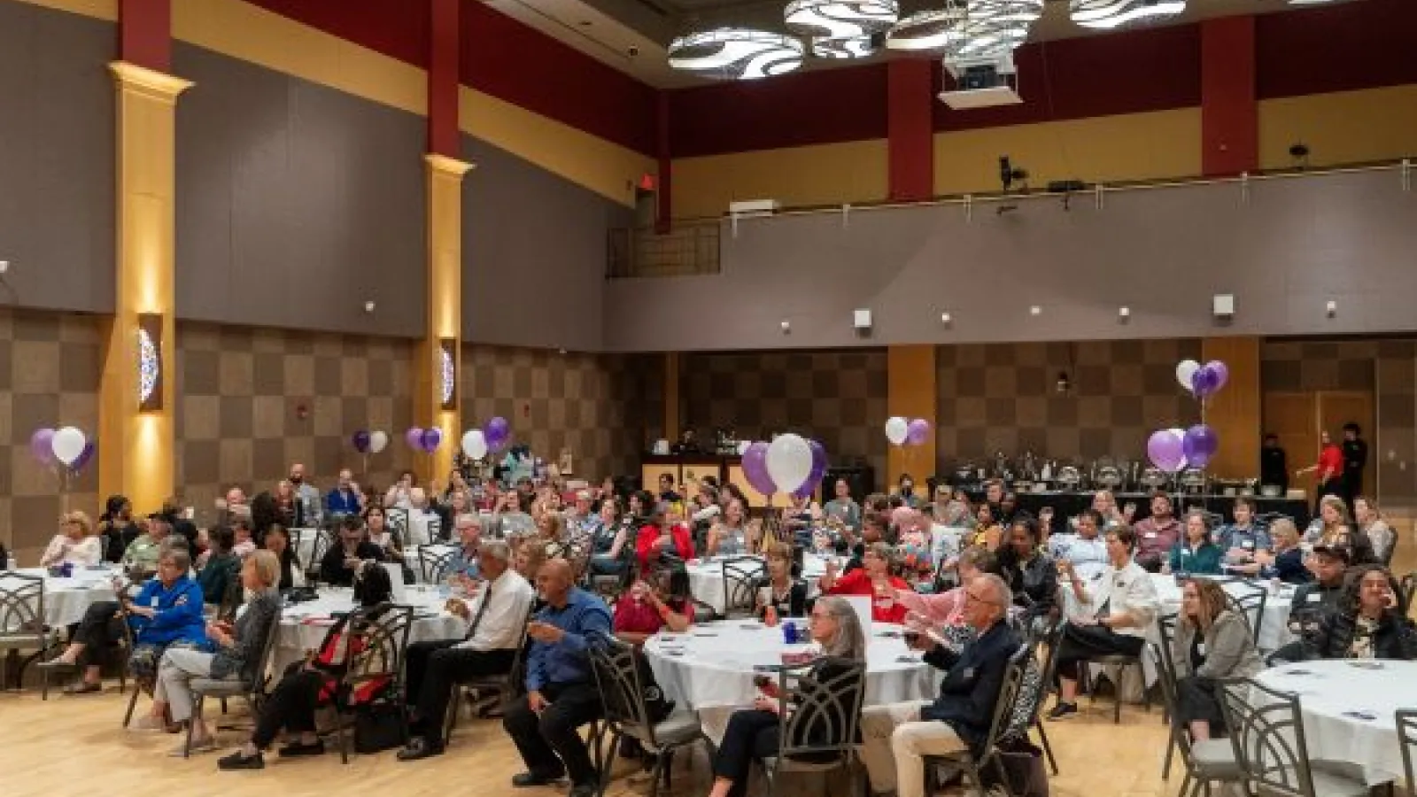 Guests sitting at tables at Ohio Union during WGSS 50th anniversary dinner reception